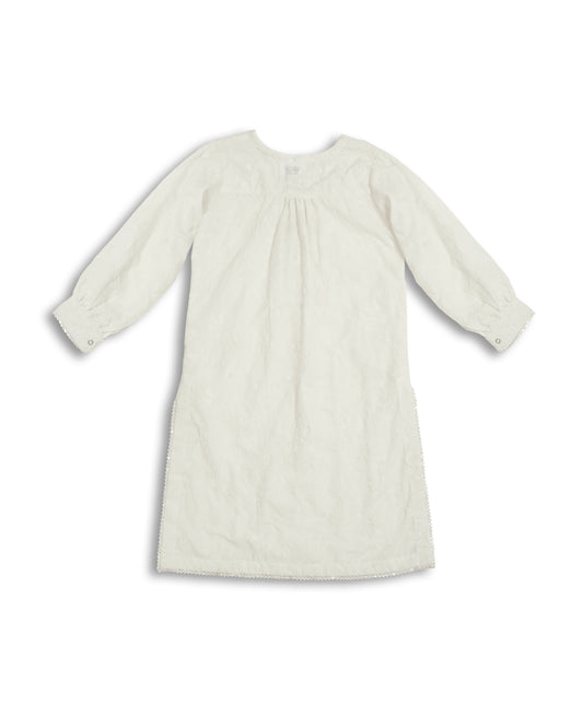 White chikankari cotton kids kurti with embroidered texture, full sleeves, lace-trim hem, and round neckline — handcrafted Pakistani kids clothing.