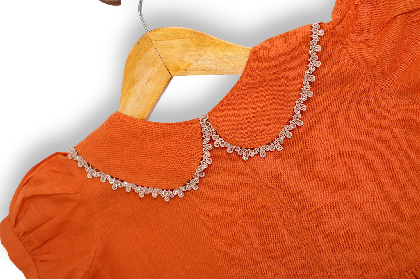 Orange cotton khaddar girls frock and trouser set with lace-trim Peter Pan collar, gathered waist, and delicate hem—Pakistani kids clothing