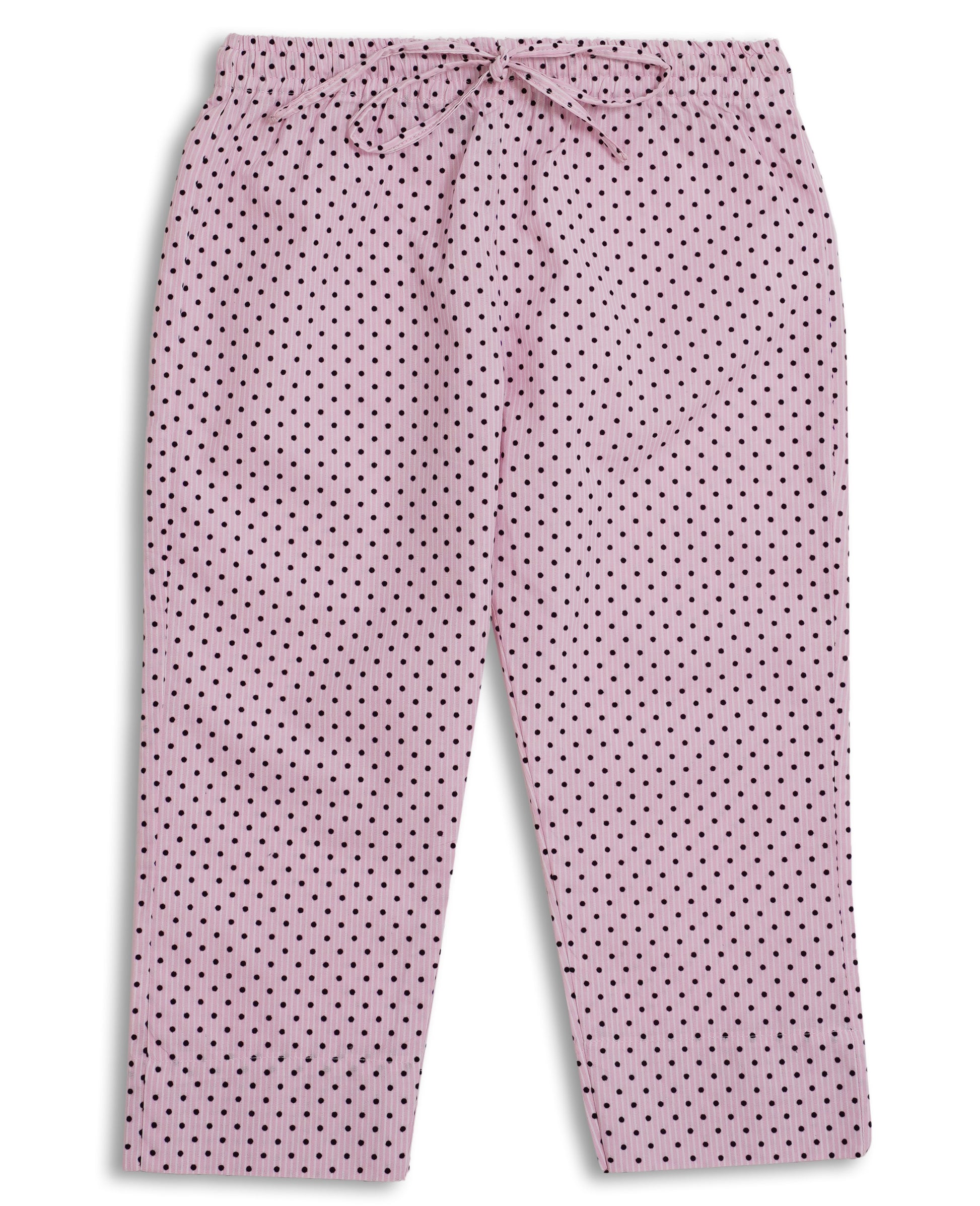 Perfect soft pink cotton kurta pajama set with black polka dots, featuring a round neck and button placket, laid flat on a pink background. Watm and Soft fabric is perfect to pair with sweater or jacket in this weather to give a perfect look for November wear. Made with love in Pakistan for eastern clothing to be worn in Europe and Worldwide