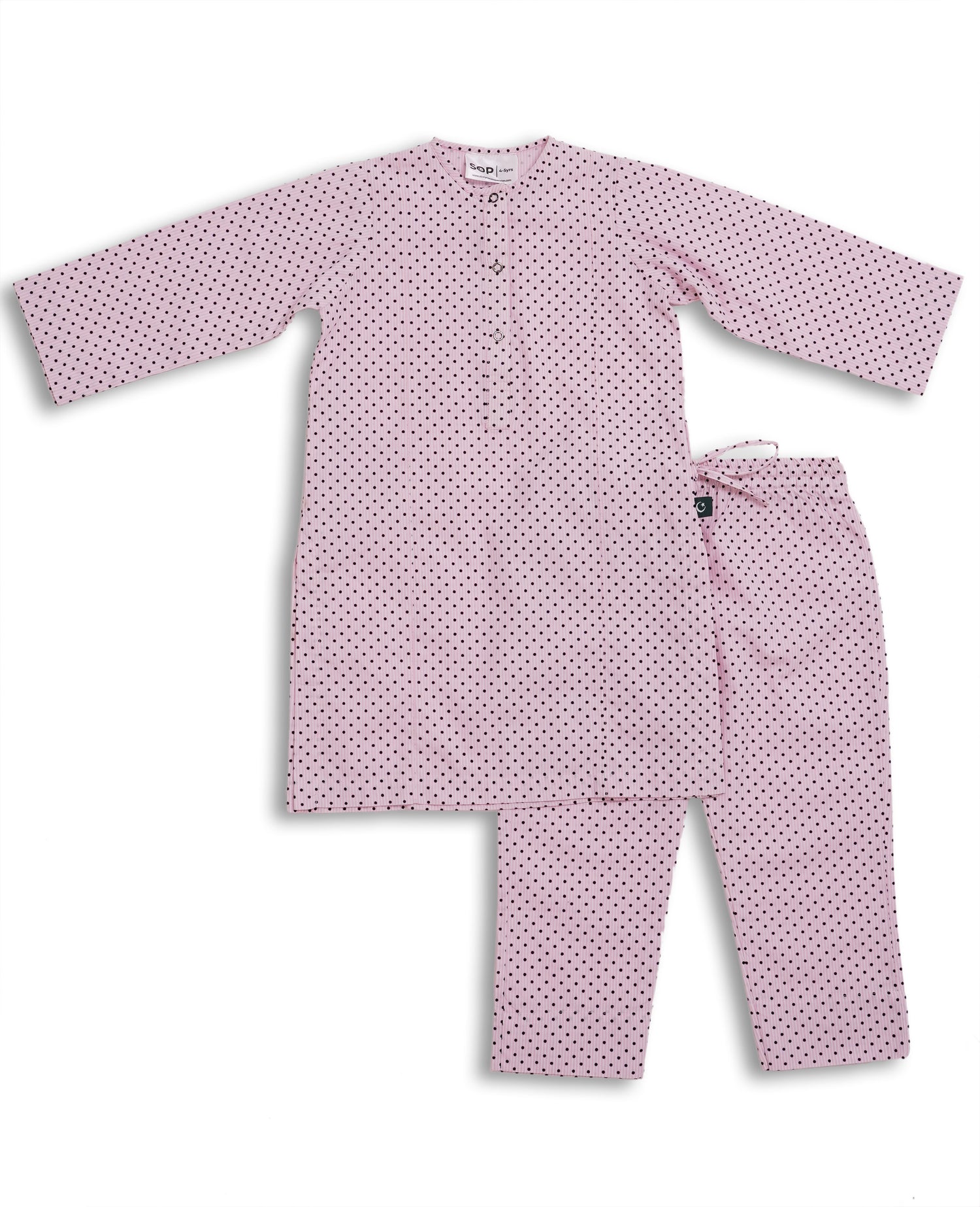 Perfect soft pink cotton kurta pajama set with black polka dots, featuring a round neck and button placket, laid flat on a pink background. Watm and Soft fabric is perfect to pair with sweater or jacket in this weather to give a perfect look for November wear. Made with love in Pakistan for eastern clothing to be worn in Europe and Worldwide
