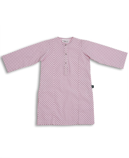 Perfect soft pink cotton kurta pajama set with black polka dots, featuring a round neck and button placket, laid flat on a pink background. Watm and Soft fabric is perfect to pair with sweater or jacket in this weather to give a perfect look for November wear. Made with love in Pakistan for eastern clothing to be worn in Europe and Worldwide