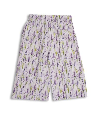 White cotton kids kurta and loose trouser set with lavender floral print, tassel neckline, and lace-edged sleeves — Pakistani kids clothing handcrafted in breathable fabric